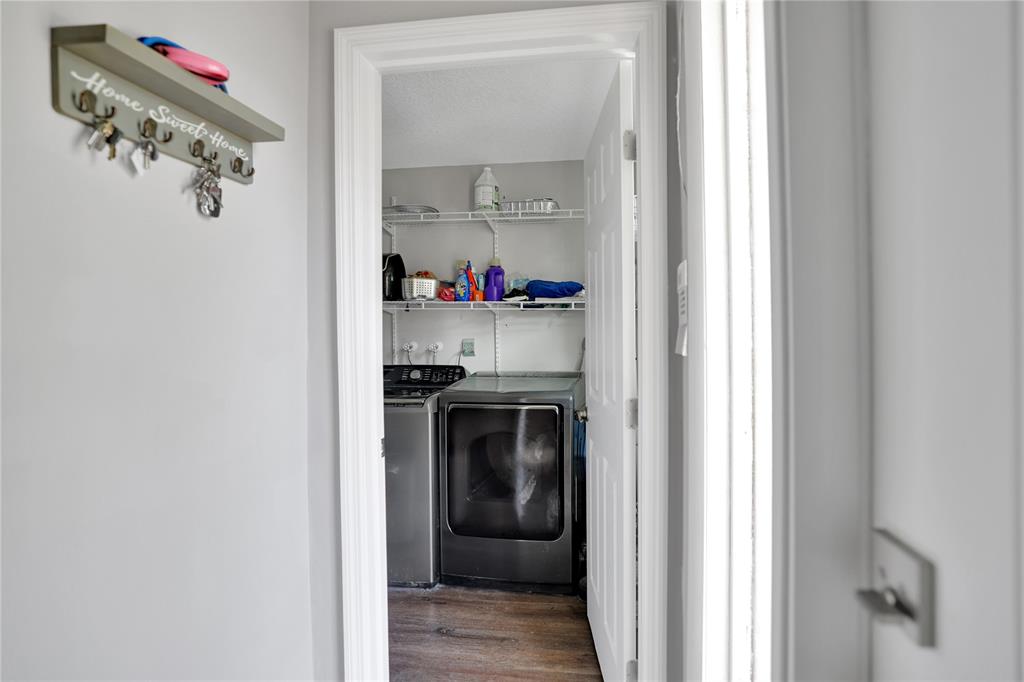 10700 Northwest 30th Place, Unit 7 Sunrise, FL 33322 - Photo 15 of 21 a view of a utility room with washer and dryer