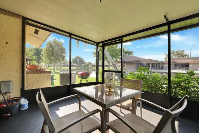 a view of a living room and floor to ceiling window