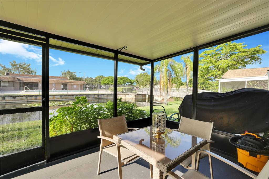 10700 Northwest 30th Place, Unit 7 Sunrise, FL 33322 - Photo 17 of 21 a view of a city from a dining room with large windows