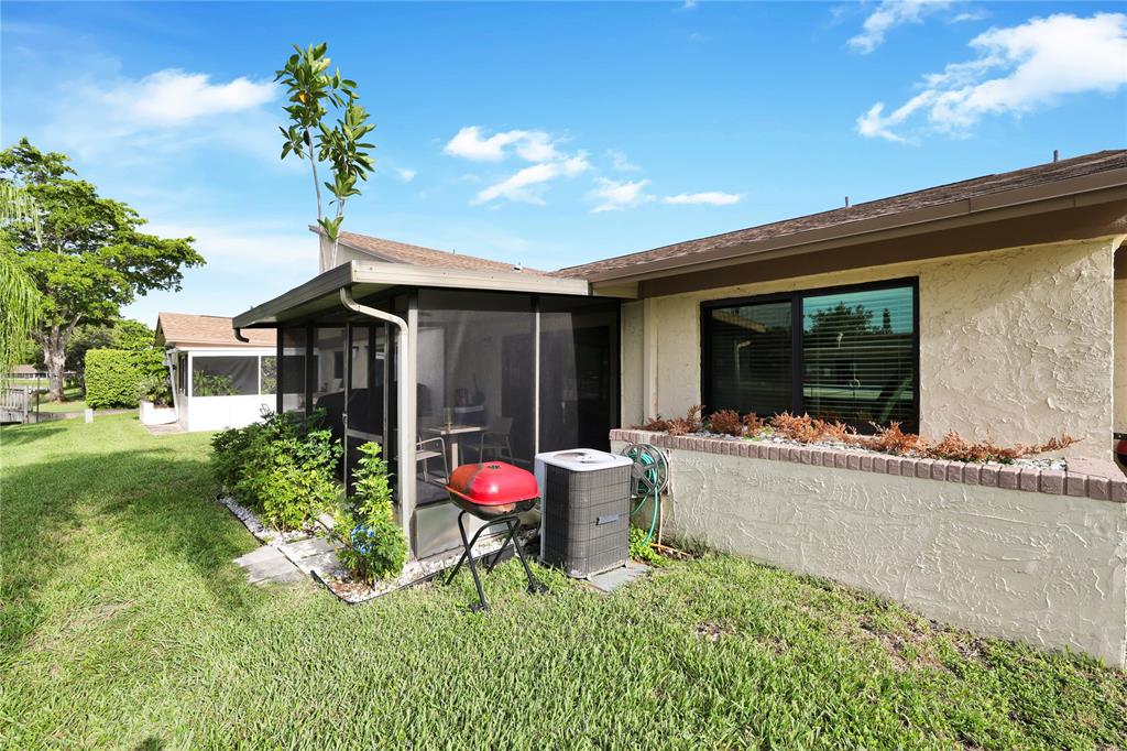 10700 Northwest 30th Place, Unit 7 Sunrise, FL 33322 - Photo 19 of 21 a swimming pool with outdoor seating and yard