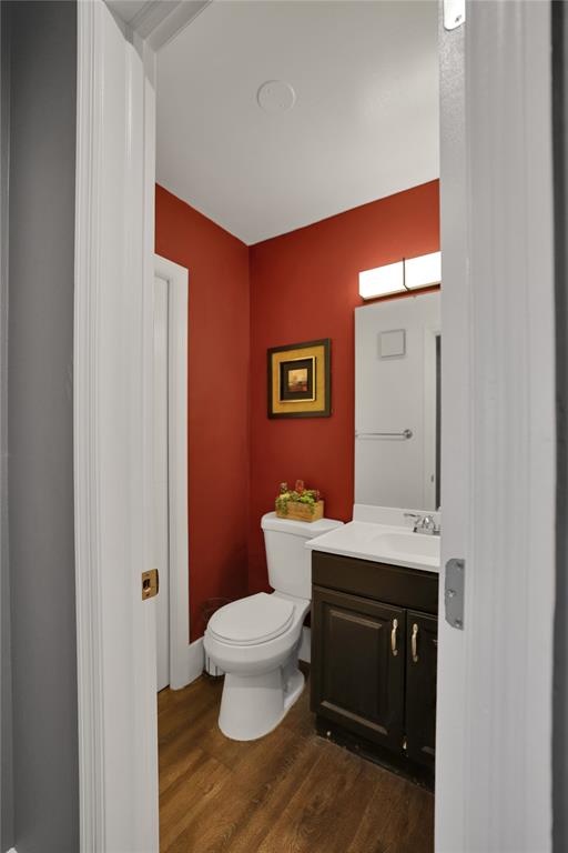 10700 Northwest 30th Place, Unit 7 Sunrise, FL 33322 - Photo 10 of 21 a bathroom with a toilet a sink and mirror