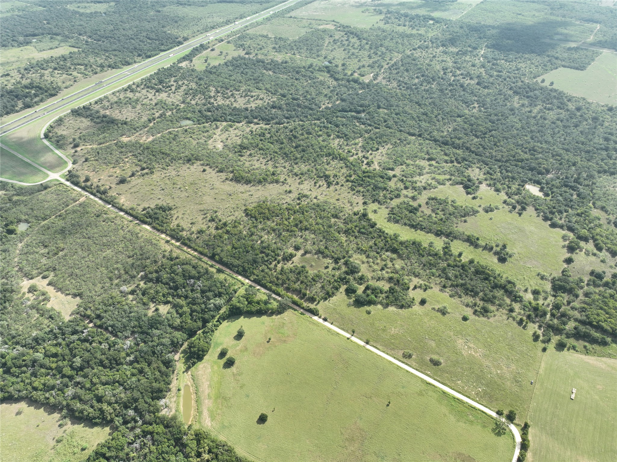 424 Rd Waelder Tx 78629 Road Waelder, TX 78959 - Photo 1 of 25 View of property location with property parcel outlined and rural landscape