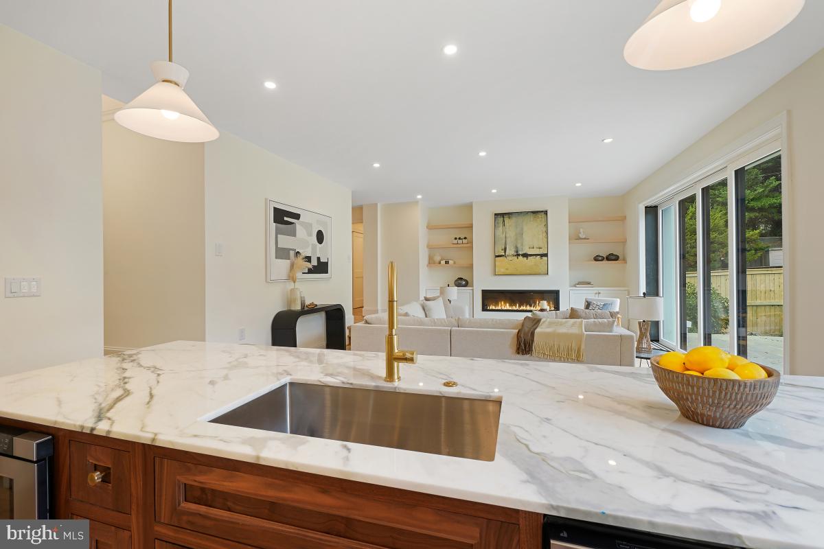 4339 Windom Place Northwest Washington, DC 20016 - Photo 17 of 45 a living room with kitchen island furniture and a potted plant