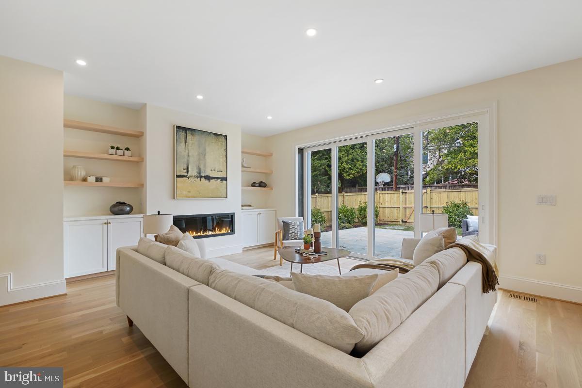 4339 Windom Place Northwest Washington, DC 20016 - Photo 23 of 45 a living room with furniture large windows and wooden floor