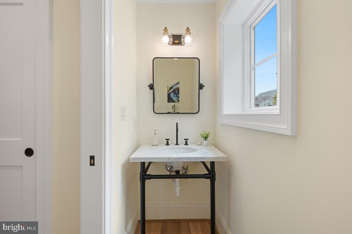4339 Windom Place Northwest Washington, DC 20016 - Photo 24 of 45 a bathroom with a sink and a mirror