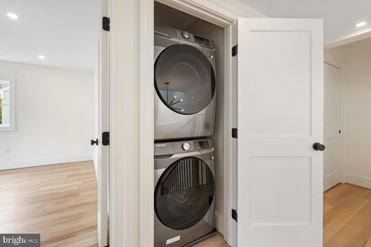 4339 Windom Place Northwest Washington, DC 20016 - Photo 28 of 45 a view of a hallway with washer and dryer