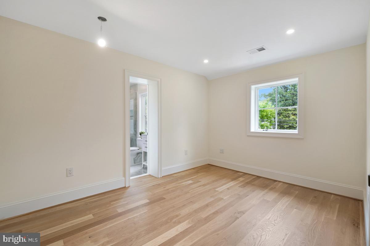 4339 Windom Place Northwest Washington, DC 20016 - Photo 30 of 45 wooden floor in an empty room with a window