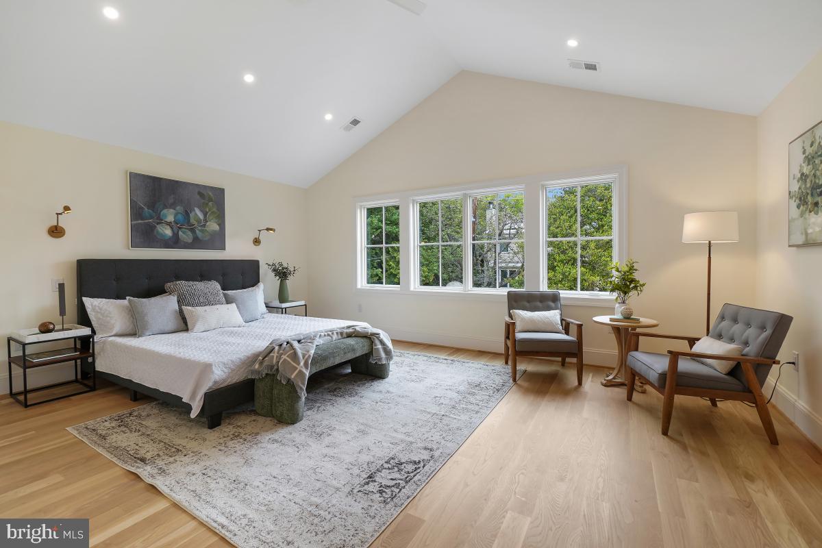 4339 Windom Place Northwest Washington, DC 20016 - Photo 32 of 45 a spacious bedroom with a bed and a couch