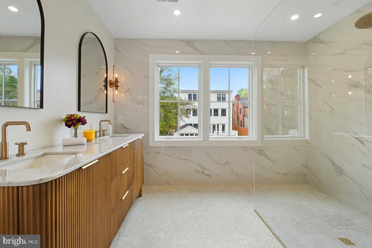 4339 Windom Place Northwest Washington, DC 20016 - Photo 36 of 45 a bathroom with double vanity windows and a sink