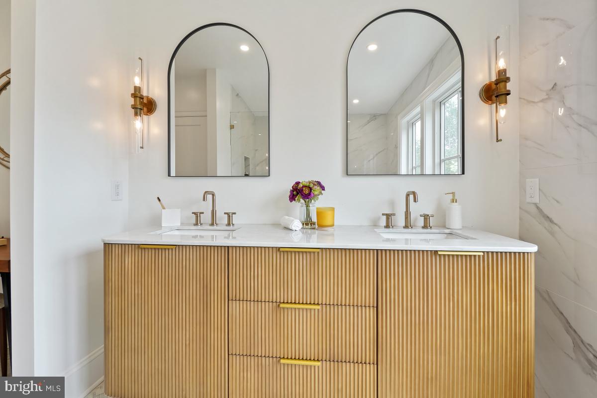 4339 Windom Place Northwest Washington, DC 20016 - Photo 37 of 45 a bathroom with a sink and a mirror