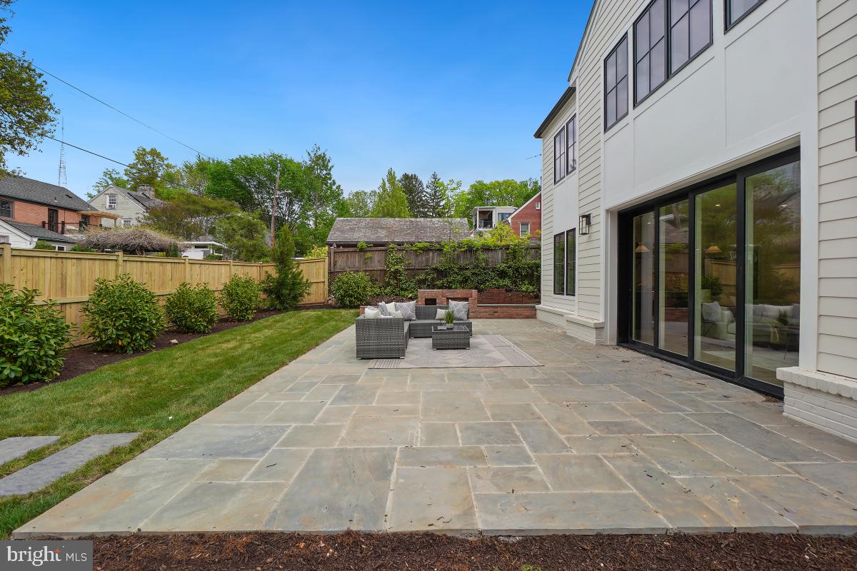 4339 Windom Place Northwest Washington, DC 20016 - Photo 45 of 45 a view of a patio with table and chairs with wooden floor and fence