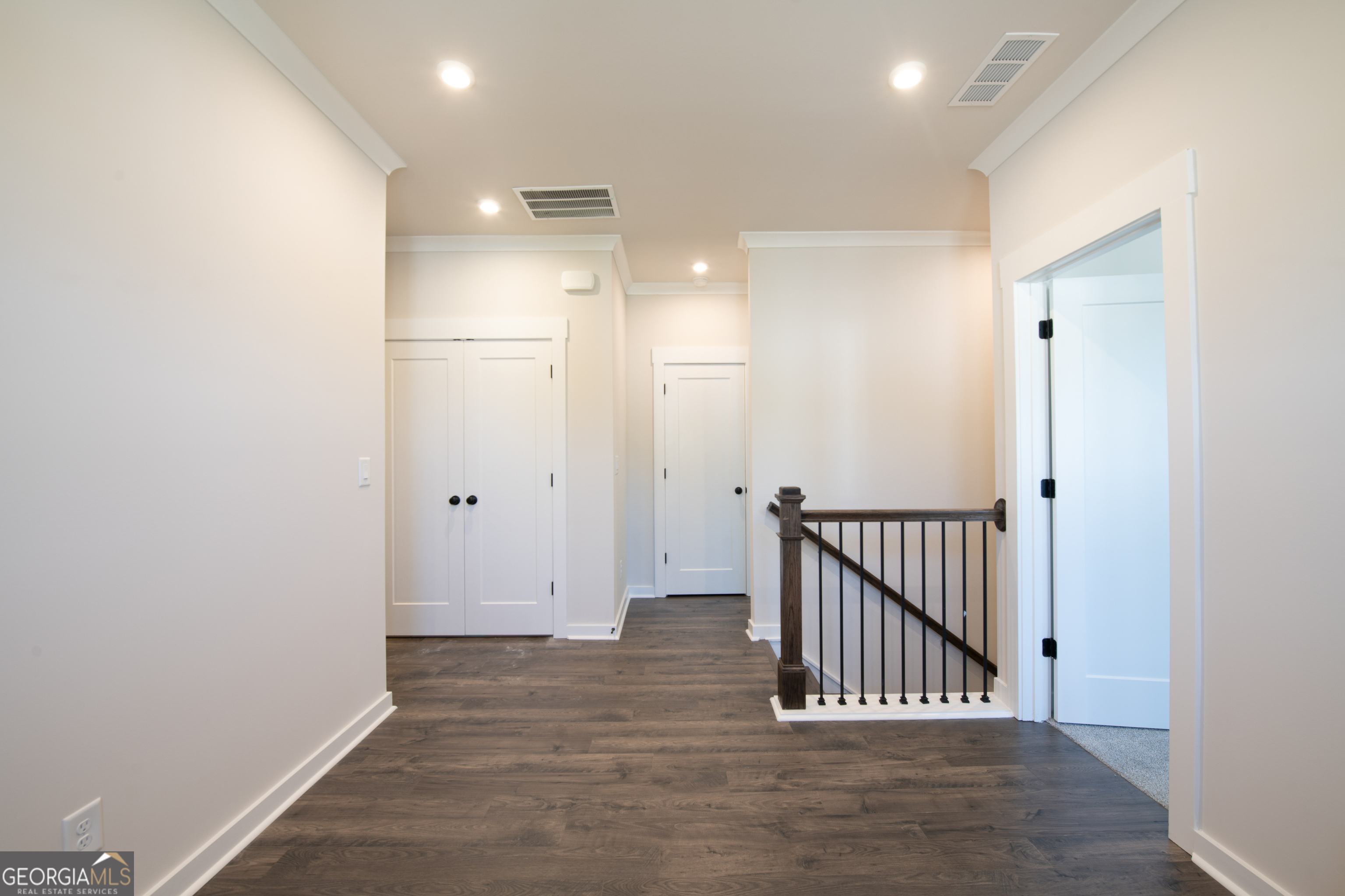 152 Henley Street, Unit 13 Canton, GA 30114 - Photo 13 of 37 a view of a hallway with wooden floor and a bathroom