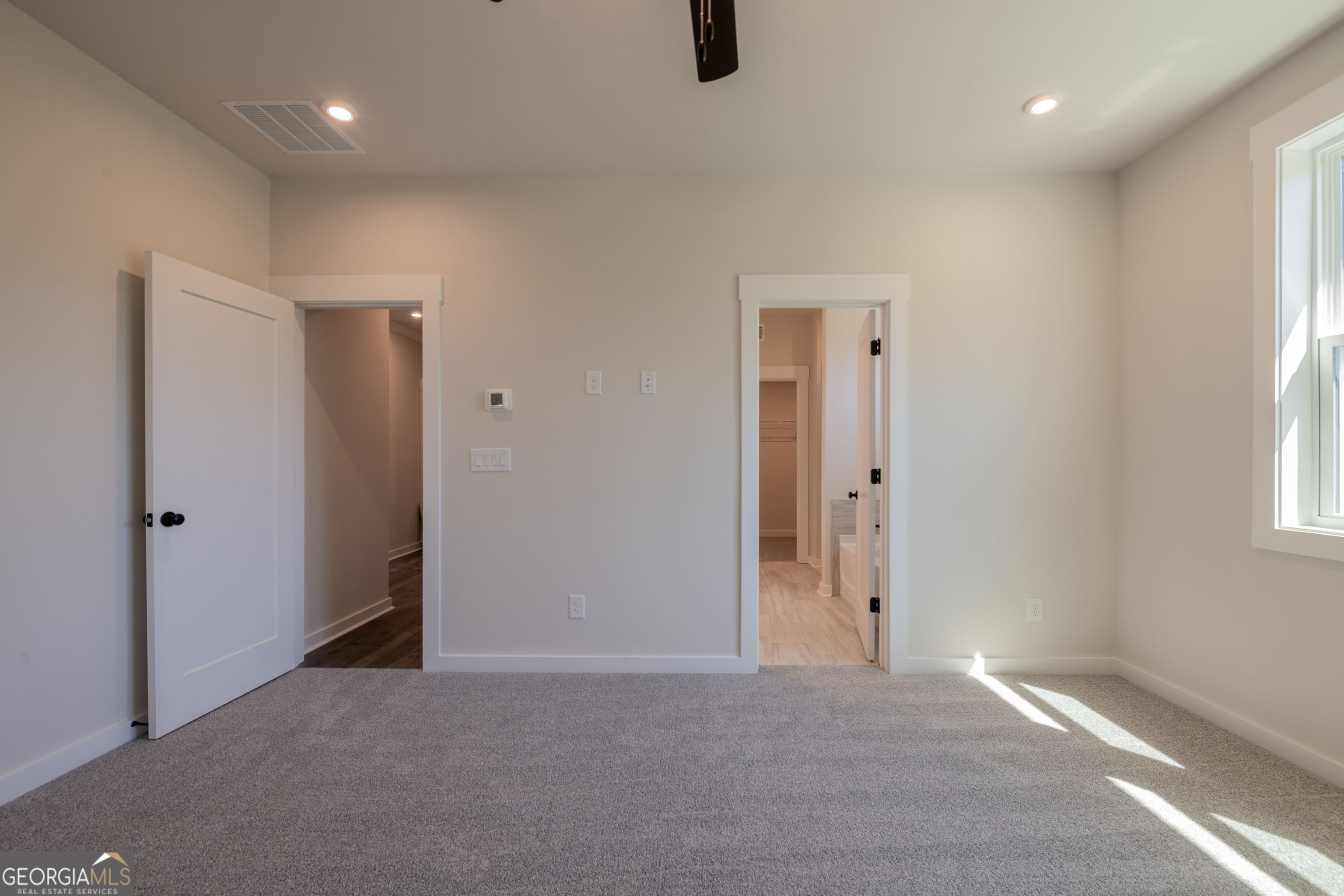 152 Henley Street, Unit 13 Canton, GA 30114 - Photo 17 of 37 an empty room with windows and closet