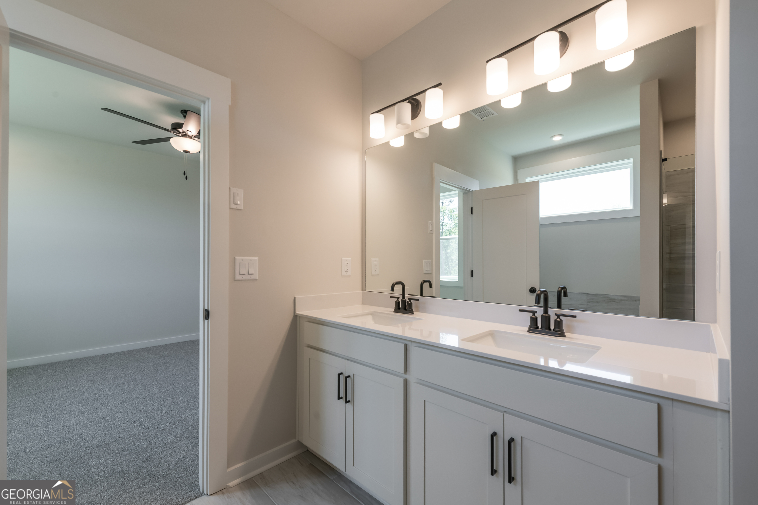 152 Henley Street, Unit 13 Canton, GA 30114 - Photo 20 of 37 a bathroom with a sink vanity and a mirror