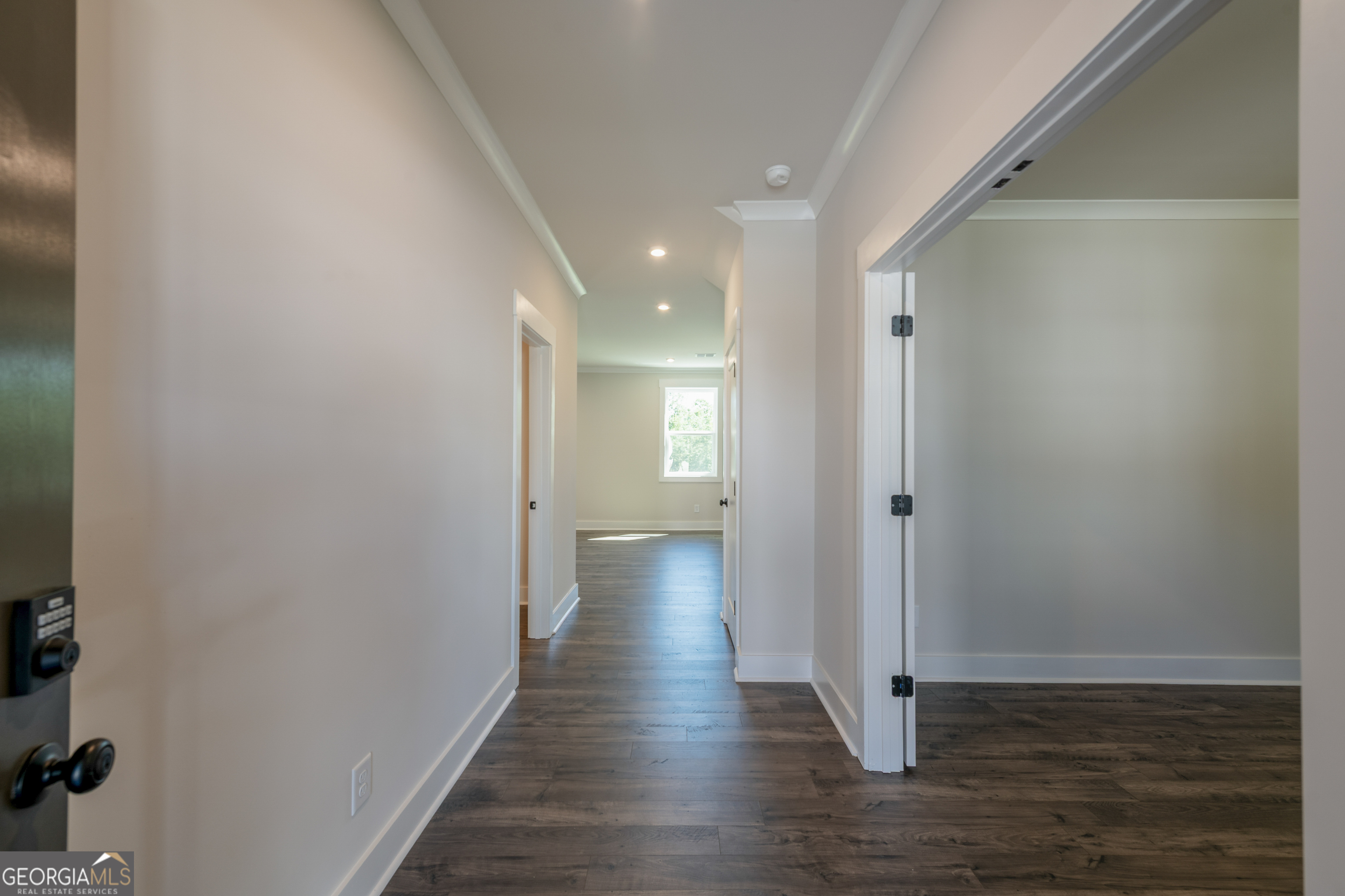 152 Henley Street, Unit 13 Canton, GA 30114 - Photo 2 of 37 a view of a hallway with wooden floor