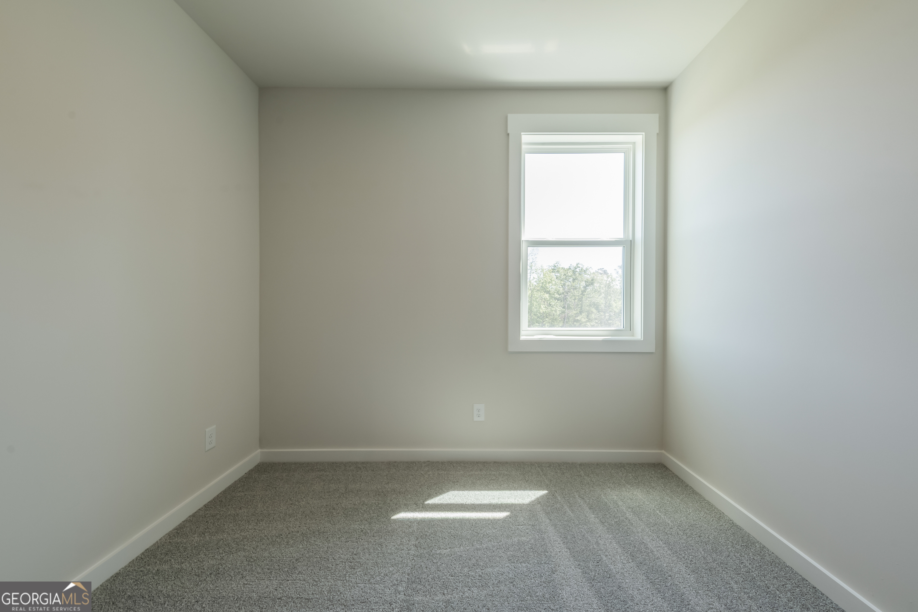 152 Henley Street, Unit 13 Canton, GA 30114 - Photo 27 of 37 an empty room with a window