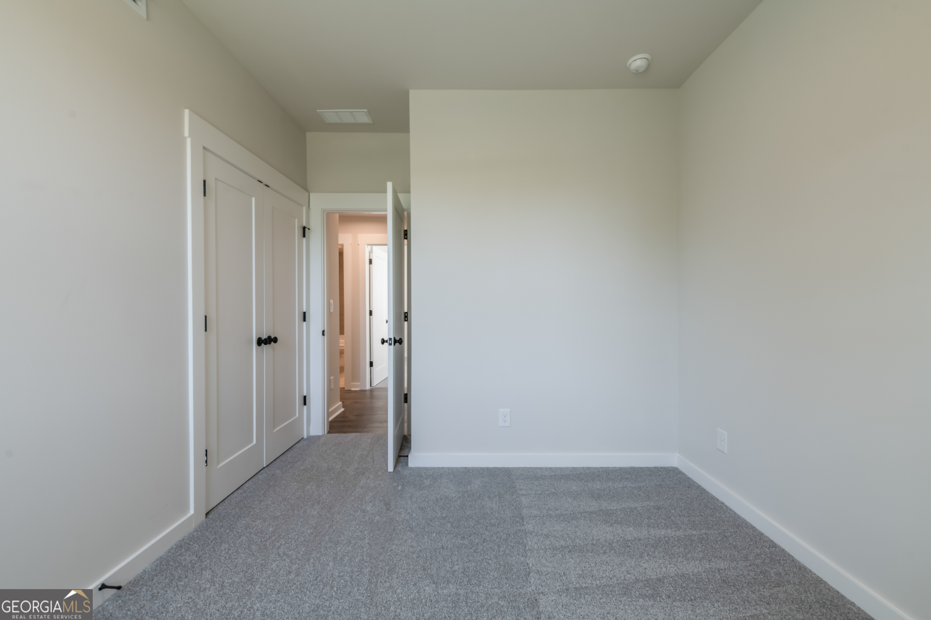 152 Henley Street, Unit 13 Canton, GA 30114 - Photo 28 of 37 a view of an empty room
