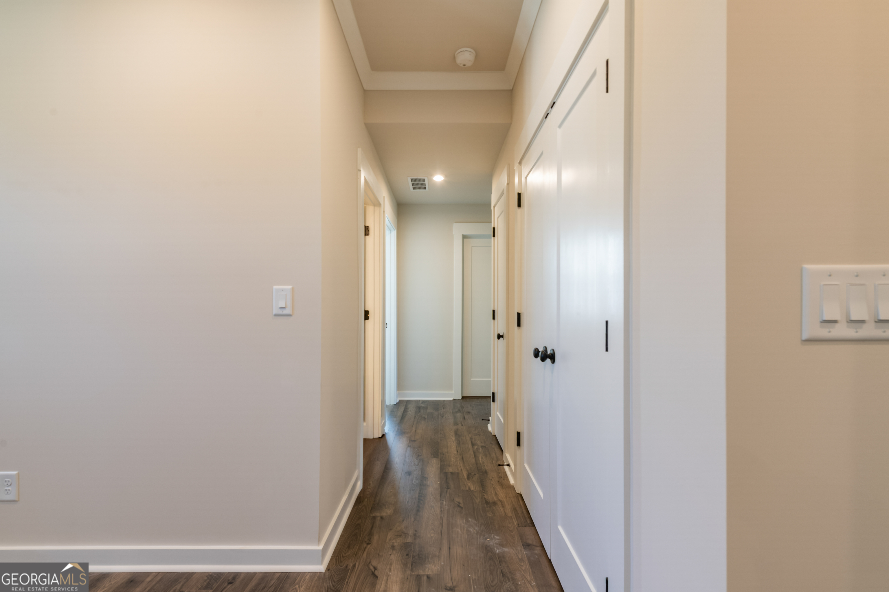 152 Henley Street, Unit 13 Canton, GA 30114 - Photo 29 of 37 a view of a hallway with wooden floor