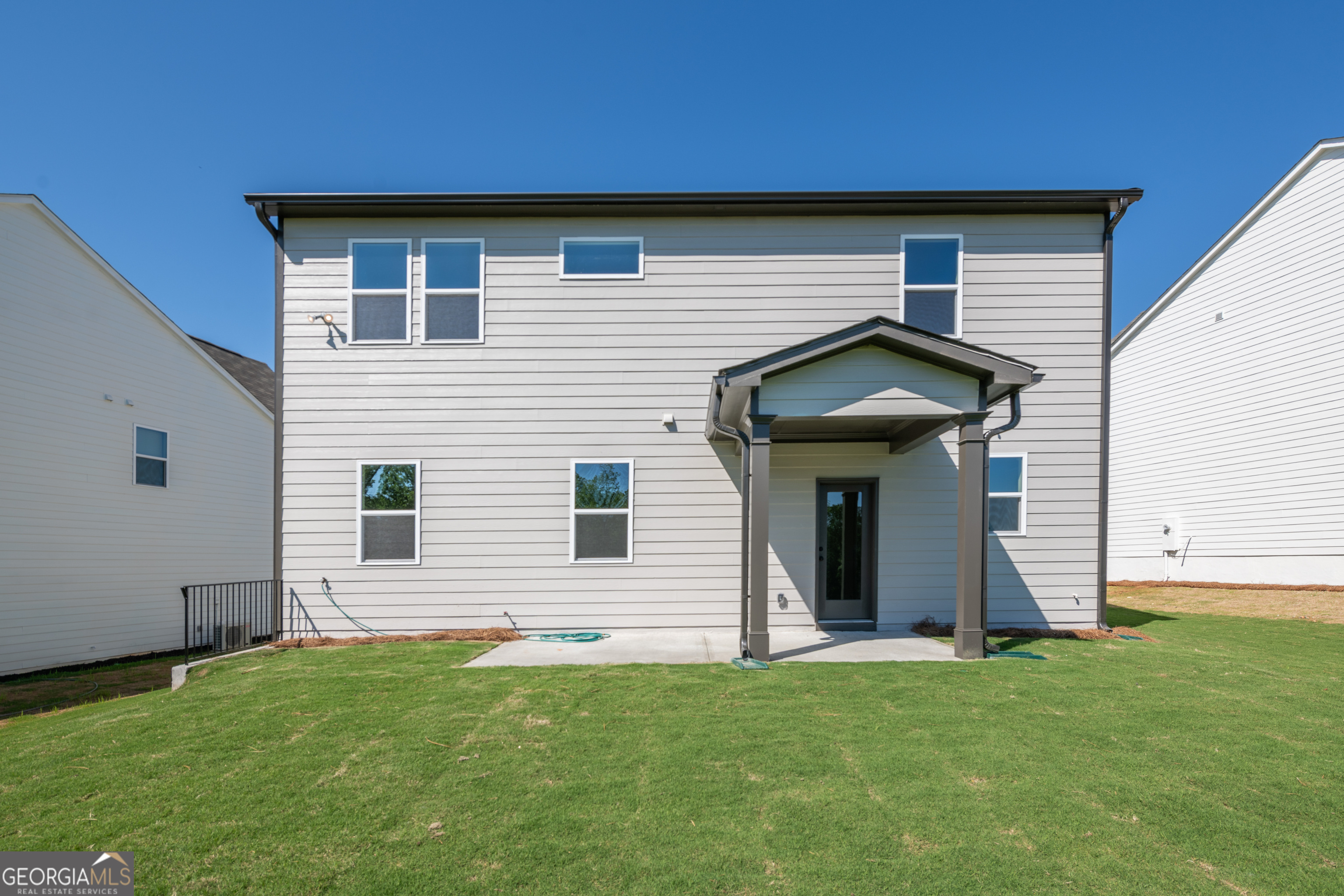 152 Henley Street, Unit 13 Canton, GA 30114 - Photo 34 of 37 a view of a house with a yard
