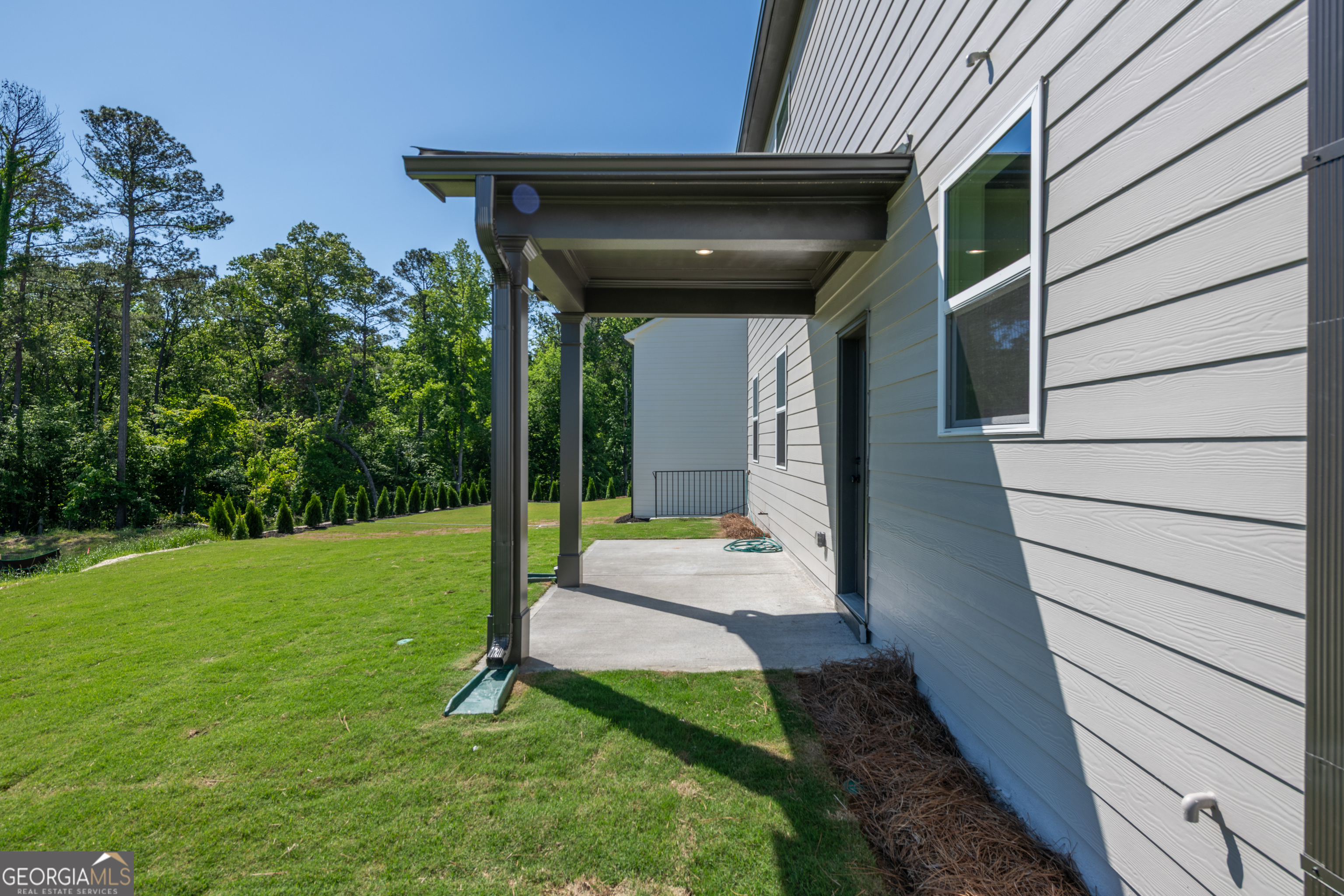 152 Henley Street, Unit 13 Canton, GA 30114 - Photo 35 of 37 a view of a house with backyard
