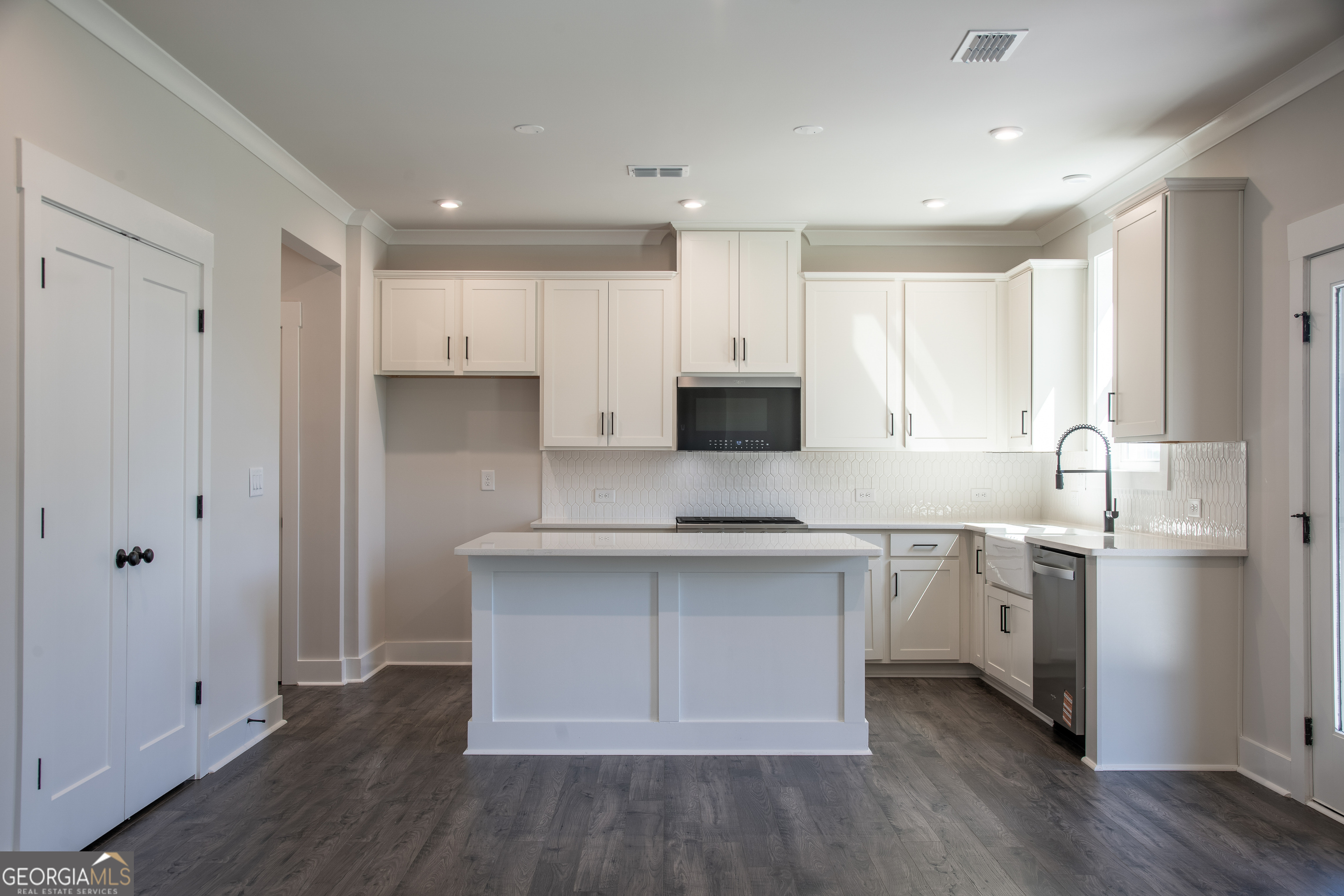 152 Henley Street, Unit 13 Canton, GA 30114 - Photo 6 of 37 a kitchen with stainless steel appliances a white stove top oven cabinets and a refrigerator