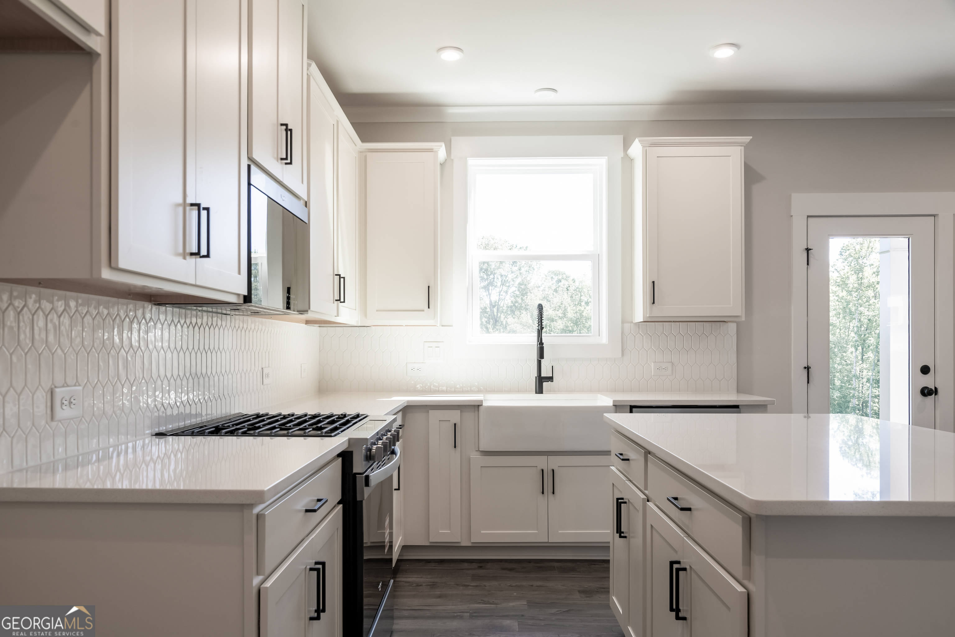 152 Henley Street, Unit 13 Canton, GA 30114 - Photo 8 of 37 a kitchen with granite countertop white cabinets and white appliances