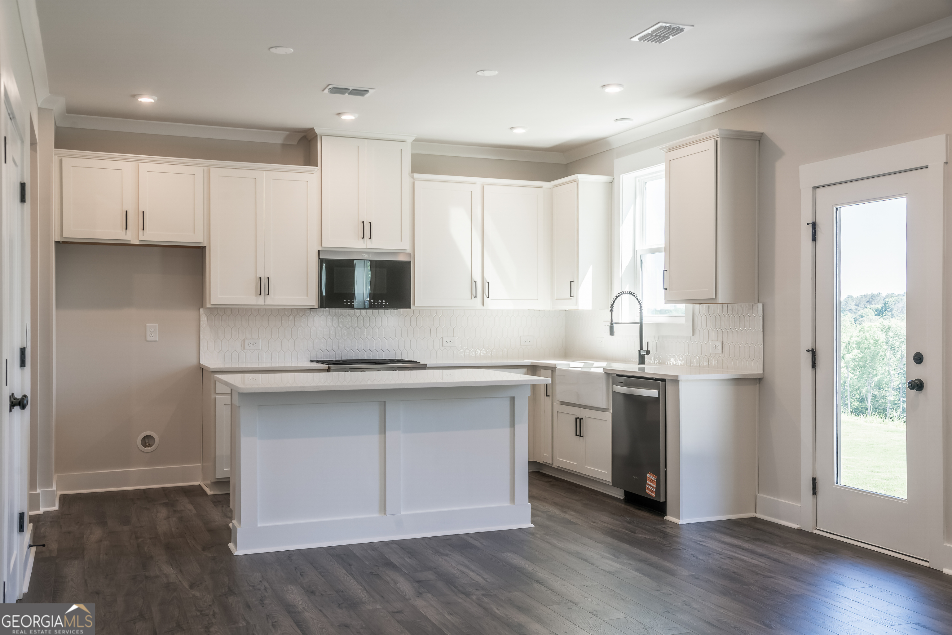 152 Henley Street, Unit 13 Canton, GA 30114 - Photo 9 of 37 a kitchen with stainless steel appliances granite countertop a stove a sink and a refrigerator