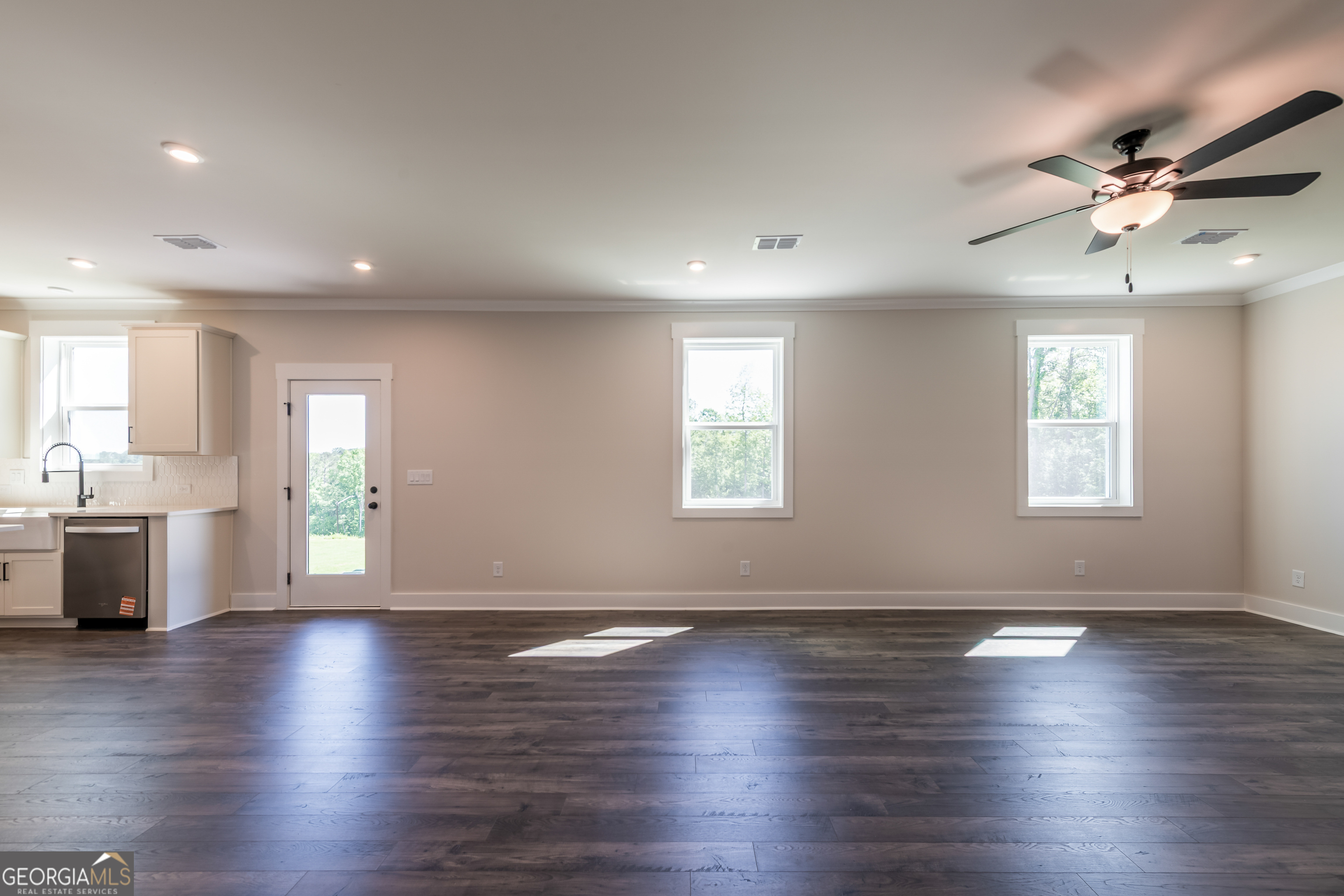 152 Henley Street, Unit 13 Canton, GA 30114 - Photo 10 of 37 an empty room with wooden floor and windows