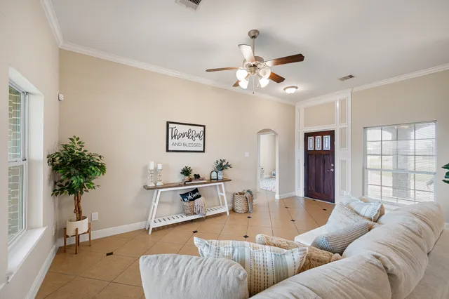 a living room with furniture and a large window