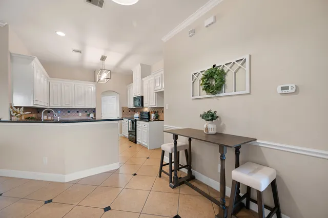 a view of kitchen with furniture and wooden floor