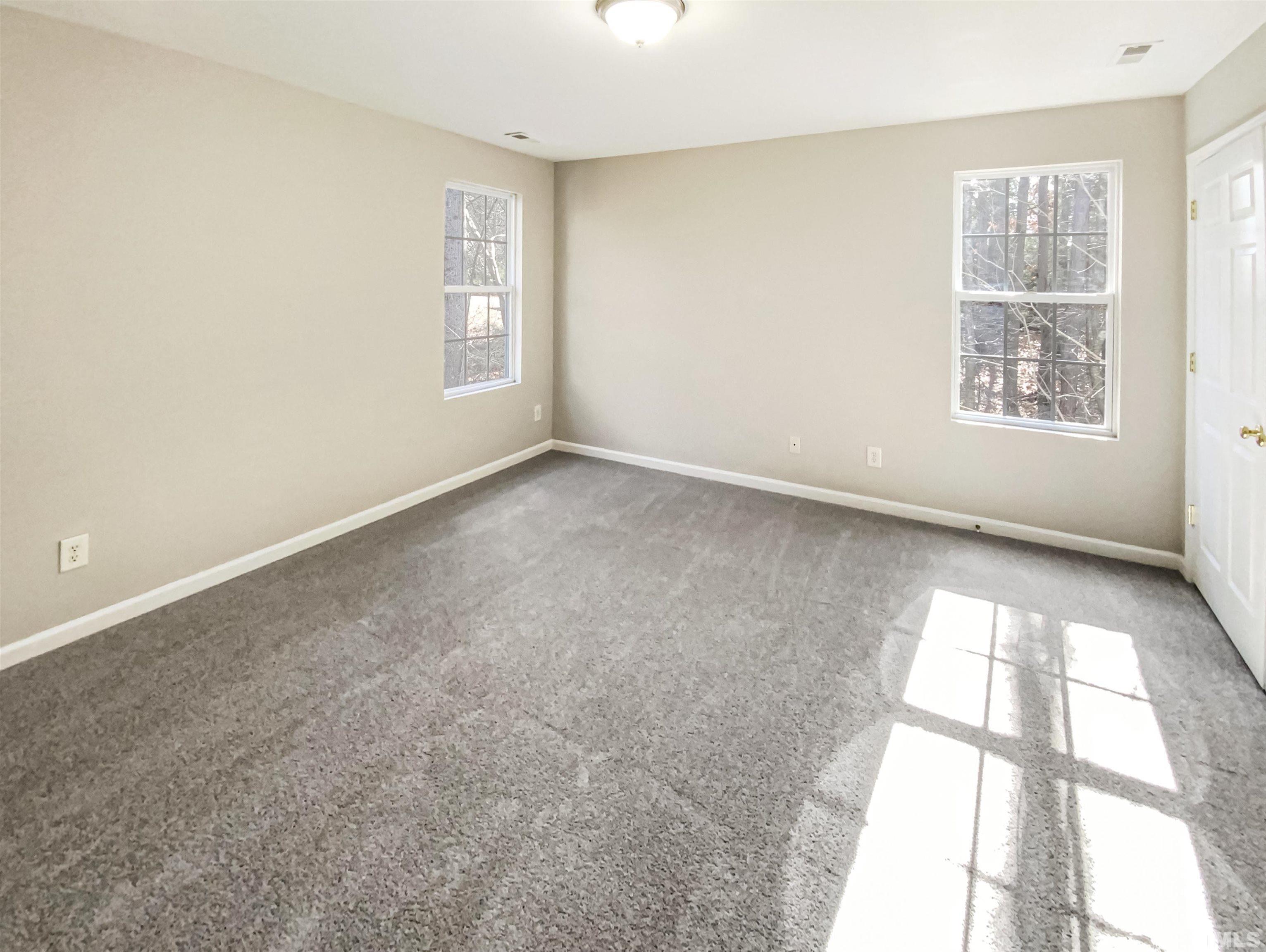 203 Caley Road Apex, NC 27502 - Photo 18 of 19 an empty room with windows