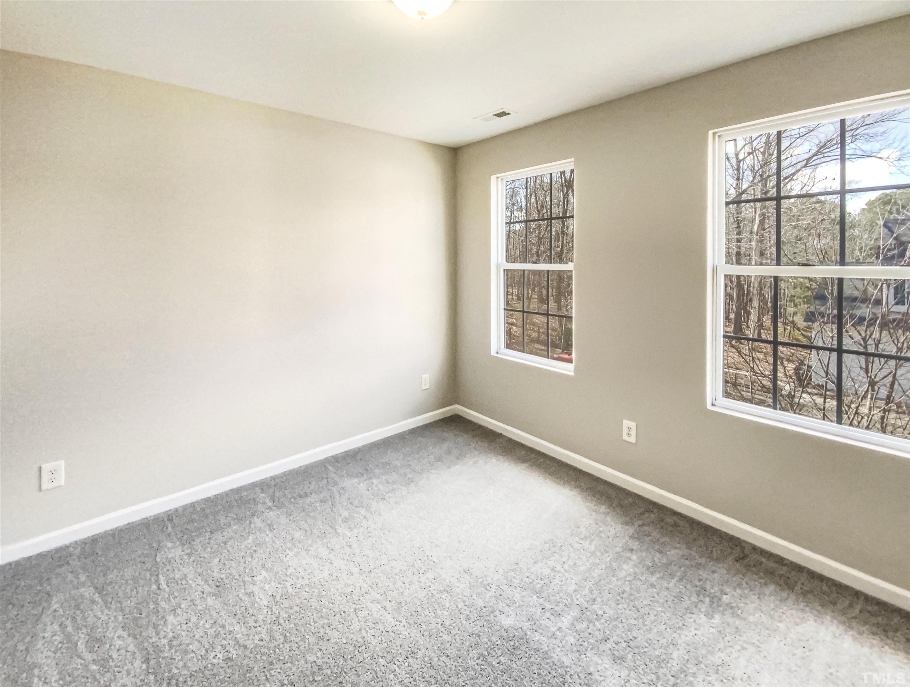 203 Caley Road Apex, NC 27502 - Photo 4 of 19 an empty room with a window