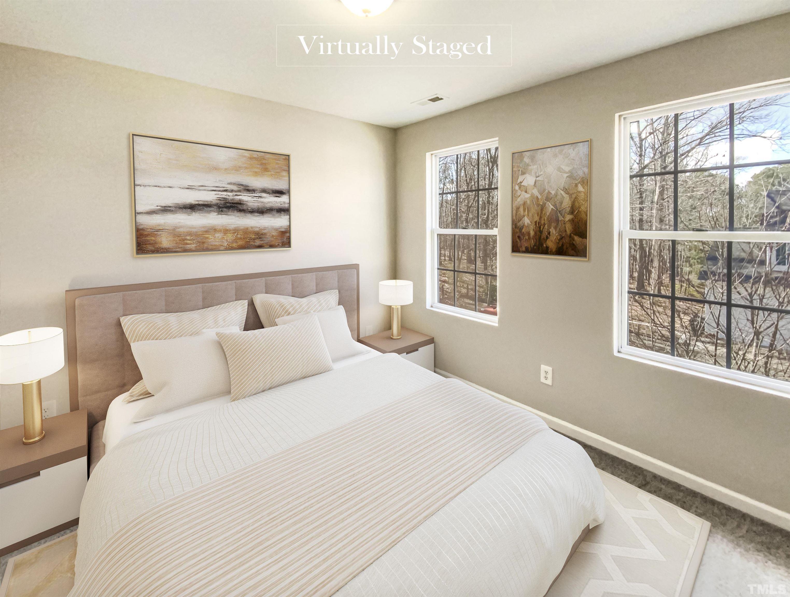 203 Caley Road Apex, NC 27502 - Photo 5 of 19 a bedroom with a bed and a large window