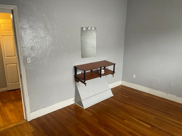 a view of a livingroom with wooden floor