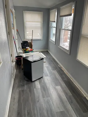 a living room with a couch and a window