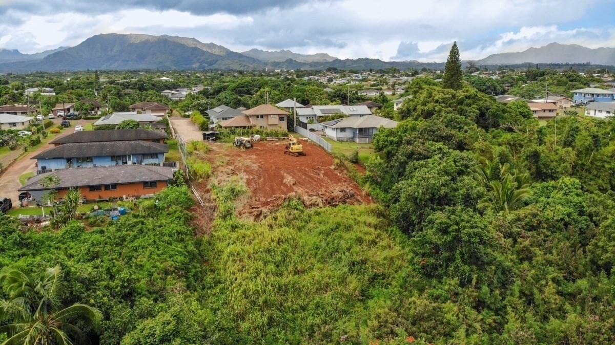 Pelehu Road, Unit 1 Kapaa, HI 96746 - Photo 1 of 3 a view of a city with lush green forest