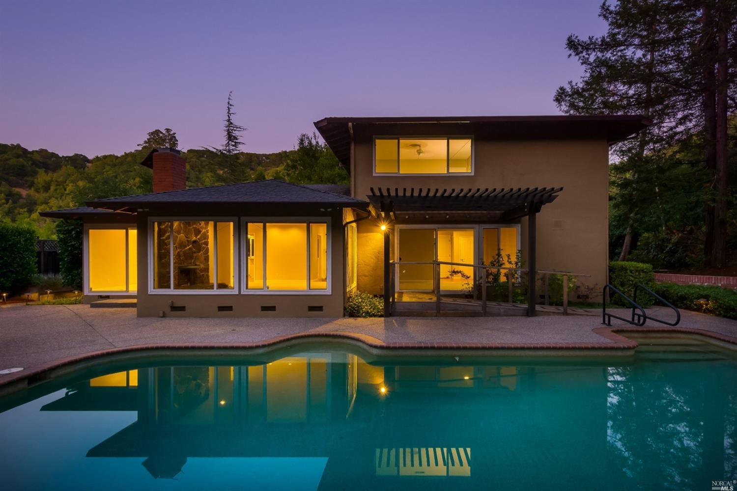 a view of a swimming pool with an outdoor seating