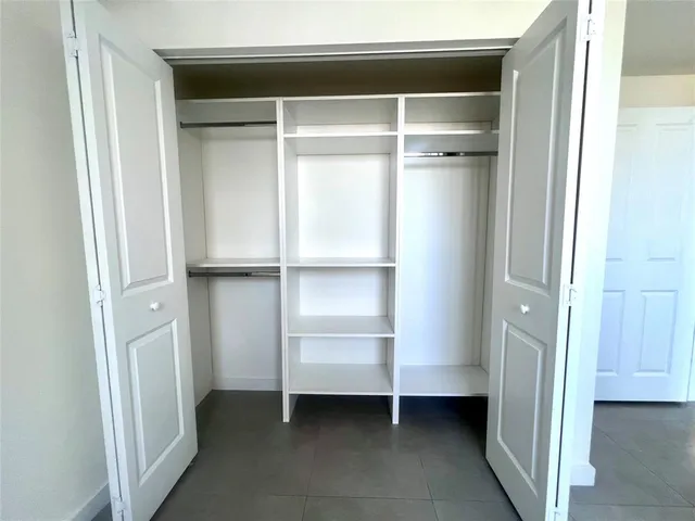 a view of an empty walk in closet