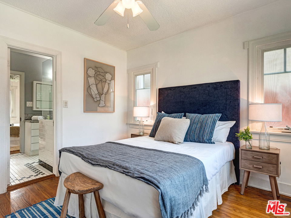 241 Ruth Avenue Venice, CA 90291 - Photo 15 of 25 a bedroom with a bed and wooden floor