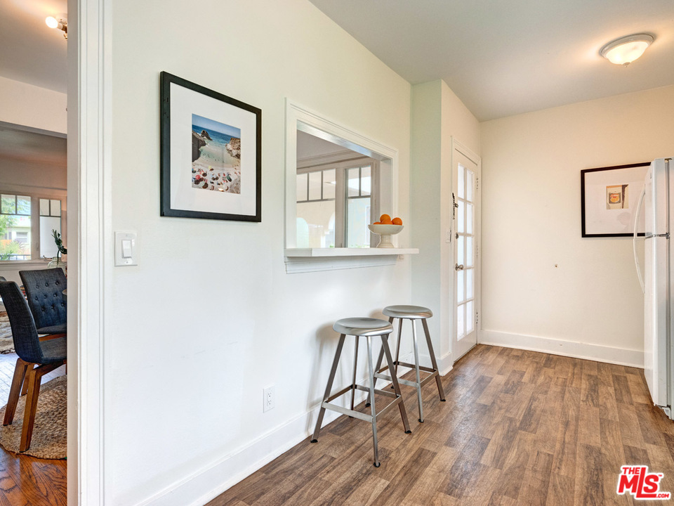 241 Ruth Avenue Venice, CA 90291 - Photo 17 of 25 a view of a workspace room with wooden floor and furniture