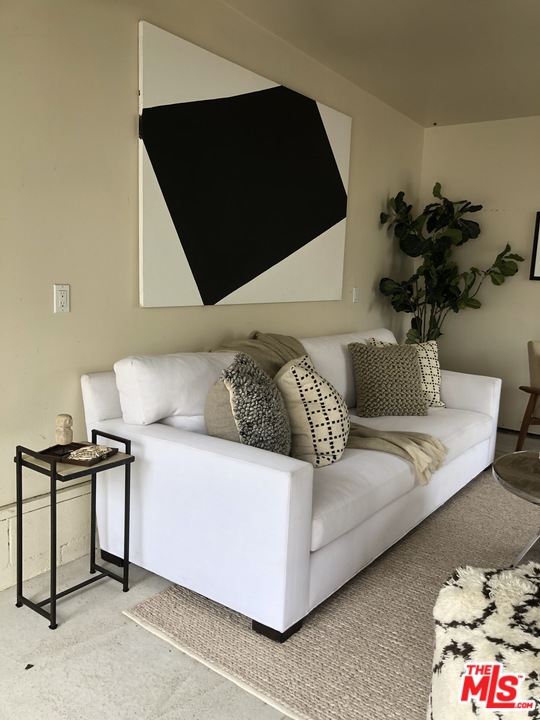 241 Ruth Avenue Venice, CA 90291 - Photo 25 of 25 a living room with a couch and a potted plant