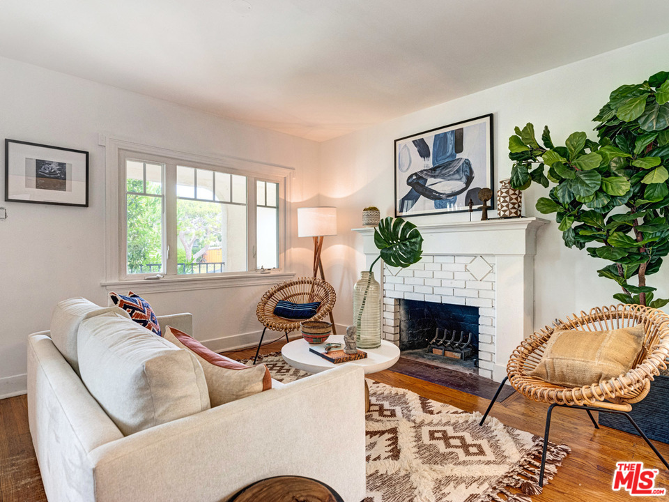 241 Ruth Avenue Venice, CA 90291 - Photo 5 of 25 a living room with furniture and a fireplace