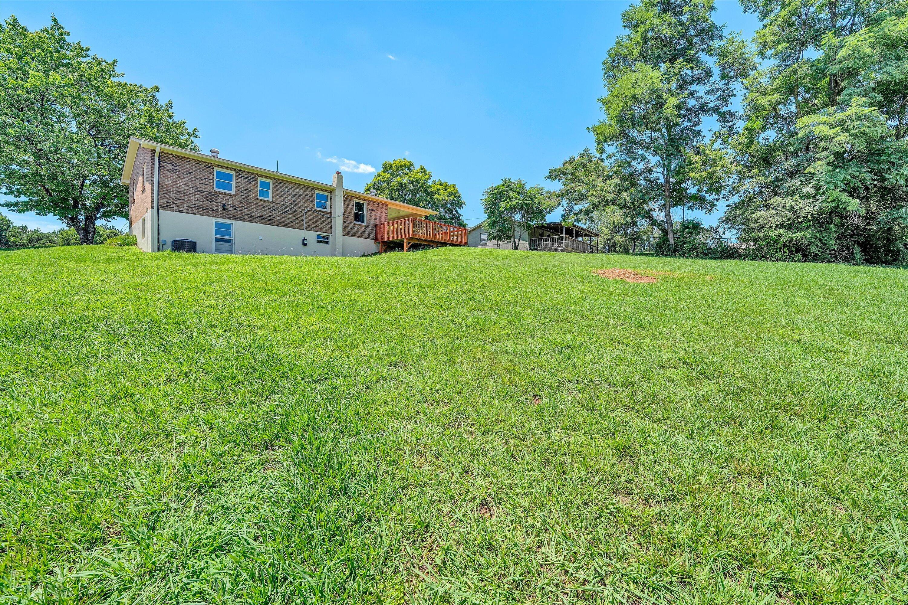 602 Power Dam Road Rocky Mount, VA 24151 - Photo 27 of 34 a view of a house with a yard and sitting area