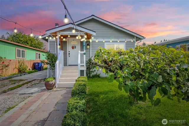 a front view of a house with garden