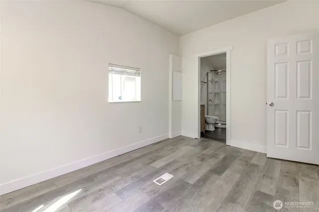 an empty room with closet area