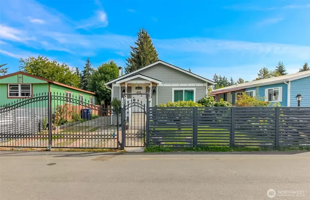 a view of a house with a fence
