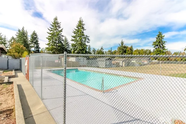 a view of a swimming pool with a lounge chairs