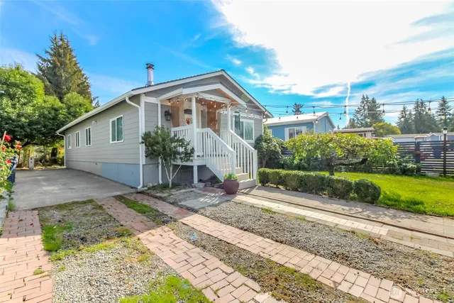 a front view of a house with garden