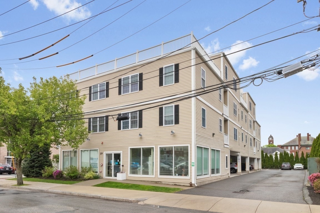 29 Spruce Street, Unit 23 Waltham, MA 02453 - Photo 1 of 26 a front view of a building
