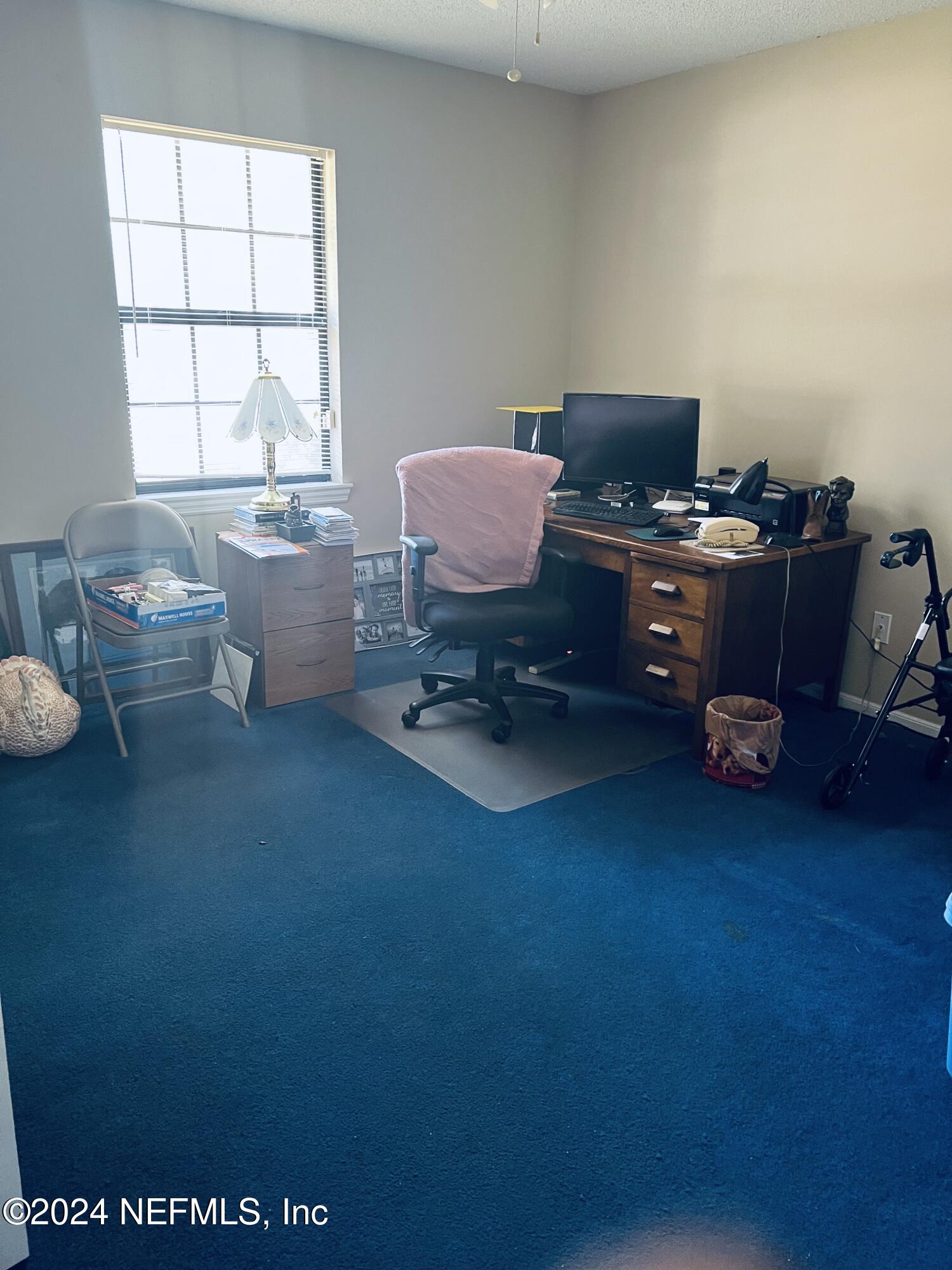 11375 Pine Loop Glen St. Mary, FL 32040 - Photo 12 of 17 a living room with furniture and a window